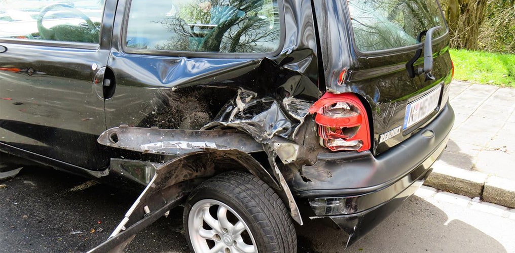 Small car damaged from a motor vehicle accident