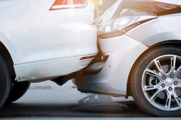 Auto accident involving two cars on a city street