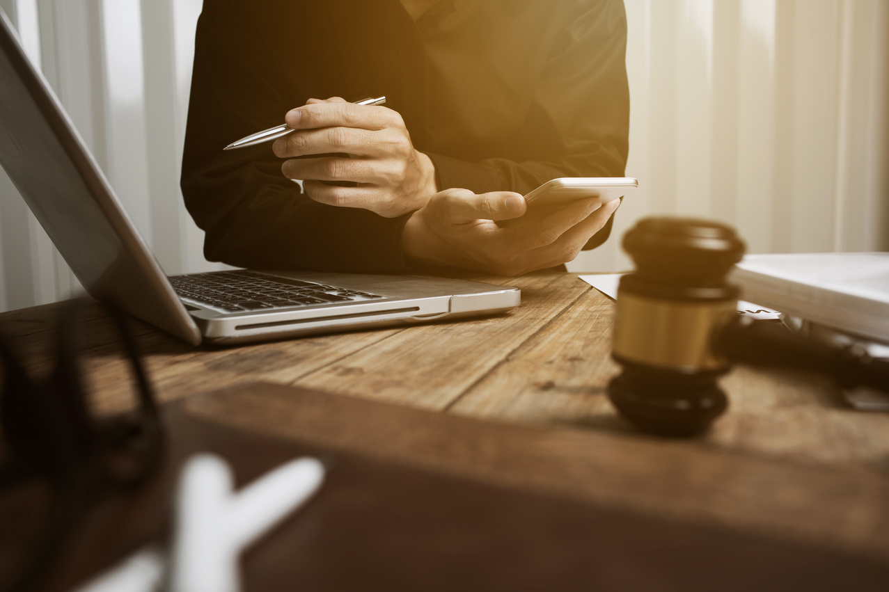 Young personal injury attorney working in his office